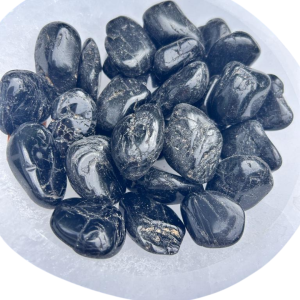 Selenite charging Bowl with an assortment of Black Tourmaline polished Healing Gemstones