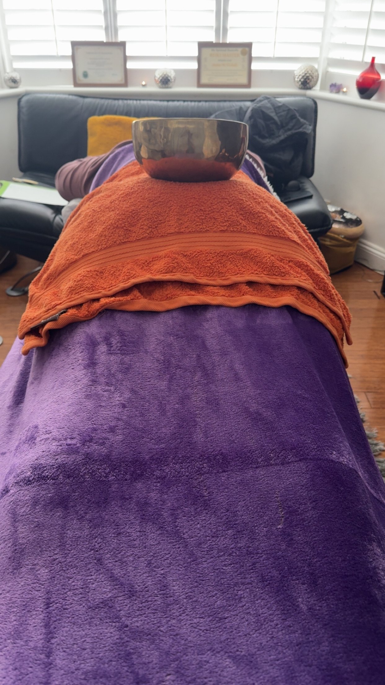 Client receives Reiki and Sound Healing therapy, whilst laying on the Therapy Couch/Bed