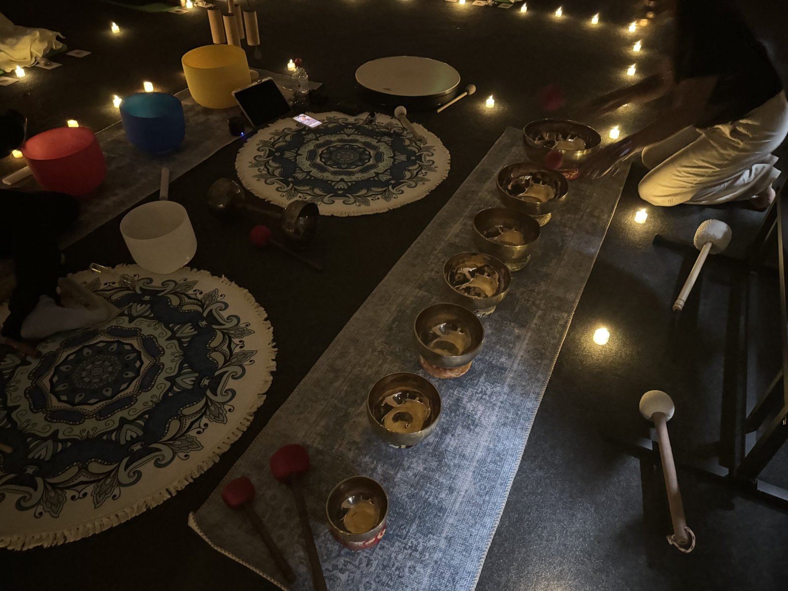 Tibetan Singing Bowls on a rug at Dahni’s Sound Bath event