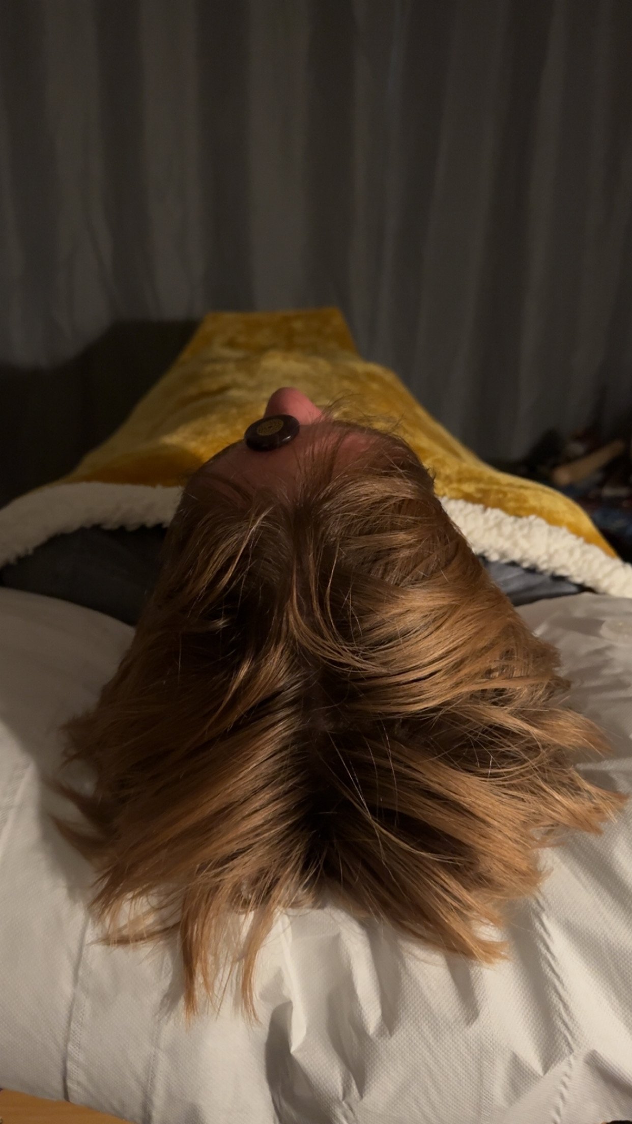 Client lays on therapy couch/Bed with Crystals placed along the chakras whilst receiving Reiki Energy Healing