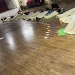 People laying down at a sound Bath event being held by Dahni a sound therapy practitioner