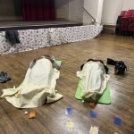 People laying down receiving sound therapy at a Sound Bath